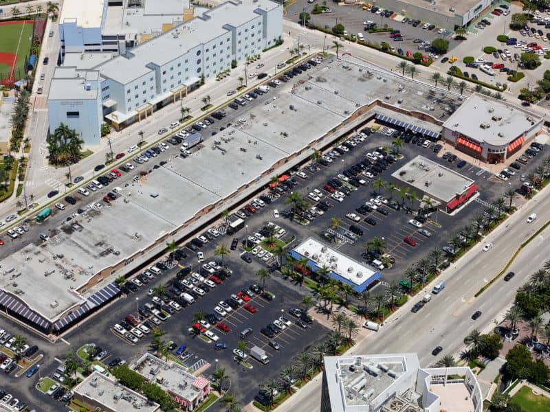Aerial view of a commercial property with shared parking areas for an ALTA survey in Columbus, Georgia.